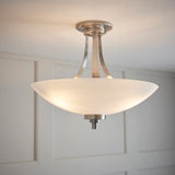 Semi flush light with a satin chrome finish complete with a white painted glass shade which has a faint line pattern. (0711WEL3SC)