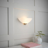 Wall light with an antique brass finish complete with a white painted glass shade. (0711WEL1WBAB)